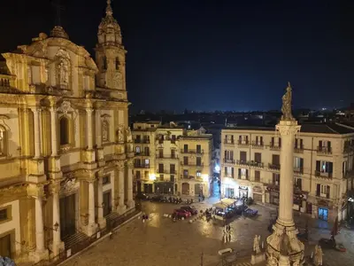 a view of a city at night at Pruni's Home by Holiday World in Palermo