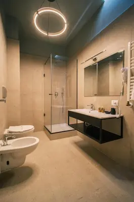 a bathroom with a toilet and a sink and a shower at LeSicilien - Fior di Sicilia - Apartment with Terrace in Palermo