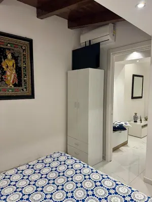 a bedroom with a bed and a cabinet in a room at Anastasia House in Palermo