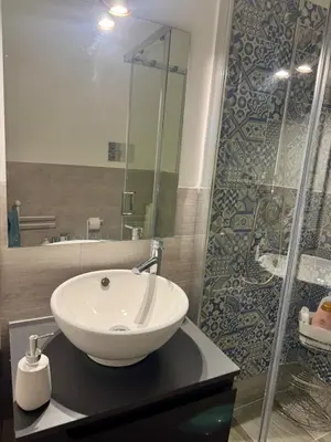 a bathroom with a sink and a shower at Anastasia House in Palermo