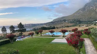 a view of a park with mountains in the background at Casa Bambù in Macari