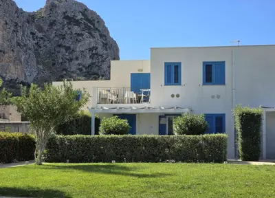 a house with a mountain in the background at Casa Bambù in Macari
