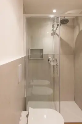 a room with a white cabinet and an archway at Vittorio Emanuele Suites&Apartments in Palermo