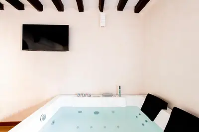 a white bathroom with a sink and a mirror at Vittorio Emanuele Suites&Apartments in Palermo
