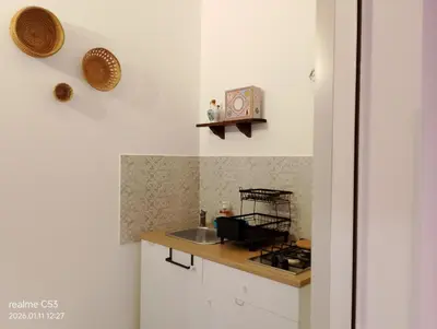 a kitchen with a white refrigerator and a microwave at Casa Claudia in Palermo