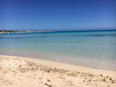 a view of the beach with the ocean at Le case di Palma in San Vito lo Capo