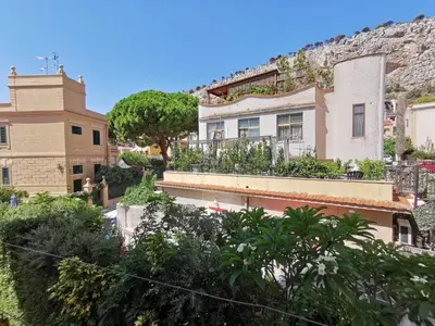 a house with plants on the side of a hill at Case d'estate Mondello in Palermo