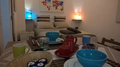 a room with a table with plates and bowls on it at Marku's House in Palermo
