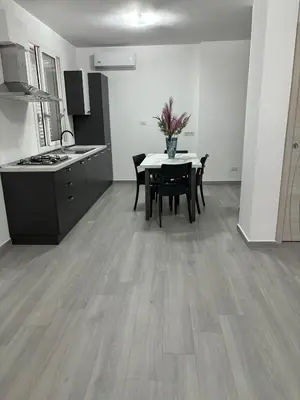 a kitchen and dining room with a table and chairs at BALISTRERI HOUSe in Trabia