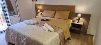 a bedroom with a large bed with flowers on it at Onyx Home in Palermo