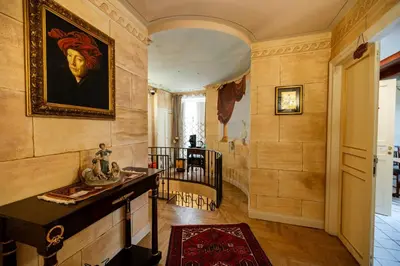 a hallway with a painting of a woman on the wall at Francy House Termini Imerese in Termini Imerese