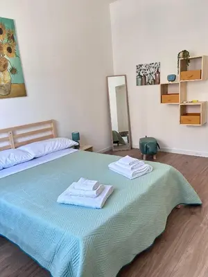 a bedroom with a bed with two towels on it at Dimora dell'Olivella 2 in Palermo