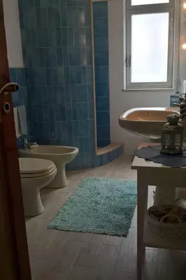 a bathroom with a tub and a toilet and a sink at Holiday Home Villa Aliotis 200m vom Meer entfernt by Interhome in Alcamo Marina