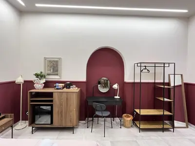 a room with a table and a bed and a chandelier at Palermo City Garden Lux Suites in Palermo