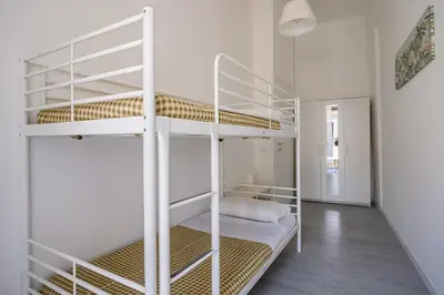 a hallway with a door leading to a bedroom at Casa Bellini - Centro Storico in Palermo