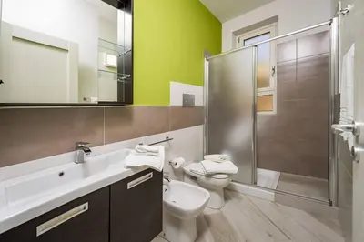 a bathroom with a sink and a toilet and a shower at APT Marta in Villa Rosaria Vista Mare Zingaro in Scopello