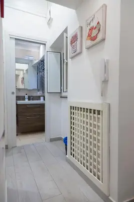 a white counter with a sink in a kitchen at Suite 9 Al Massimo Cozy Apt Next to theather in Palermo