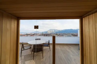 a dining room with a table and a view of the city at Skyline Boutique Hotel in Palermo
