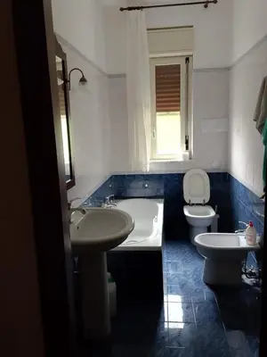 a bathroom with a tub and a sink and a toilet at Altofonte Vista in Altofonte