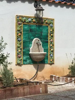 a painting of a sink on the side of a building at Holiday & House - Imparato Carini Costa Verde - Appartamento con ampia terrazza - porzione di Villa Residenziale a pochi passi dal mare in Carini