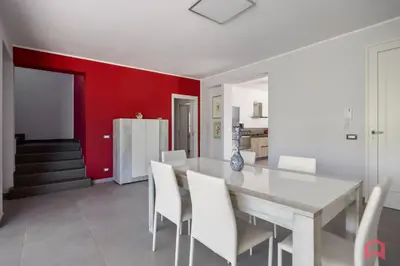 a dining room with a white table and white chairs at Villa Privata con Piscina a Scopello in Castellammare del Golfo