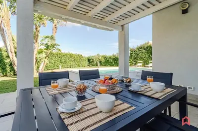 a blue table with fruit on it on a patio at Villa Privata con Piscina a Scopello in Castellammare del Golfo