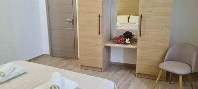 a bedroom with a bed and a mirror and a chair at Ruby Home in Palermo