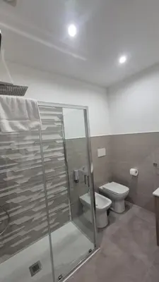 a bathroom with a shower and a toilet at Casa Leo in Palermo