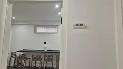 a dining room with a table and chairs at Casa Leo in Palermo