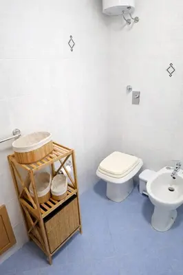 a bathroom with a shower and a toilet and a sink at Alicia in San Vito lo Capo