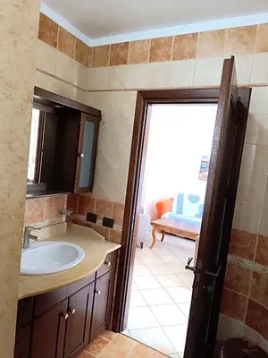 a bathroom with a sink and a mirror at Casa La Plaza in Balestrate