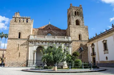 an old building with a tower and a church at Central Post Office Guest House in Palermo