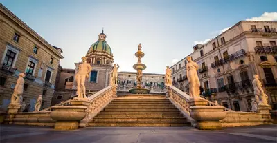 a building with a staircase in front of a building at Central Post Office Guest House in Palermo