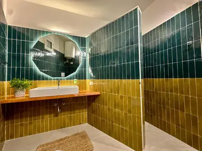 a bathroom with a sink and a mirror at Casa Manzella Apartments in Cinisi