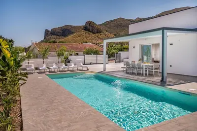 a swimming pool in the backyard of a house at Rosvì Villa in Castellammare del Golfo