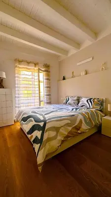 a bedroom with a large bed in a room at Casa NiMia al centro storico di Palermo in Palermo