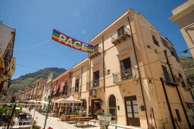 a building with a sign on top of it at GaR07 in Castellammare del Golfo