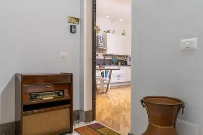 a kitchen with an old radio in a room at GuestHost - Al Cassaro Holiday Home in Palermo