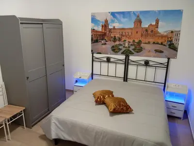 a room with a ladder next to a cabinet and a window at Casa Maria in Palermo