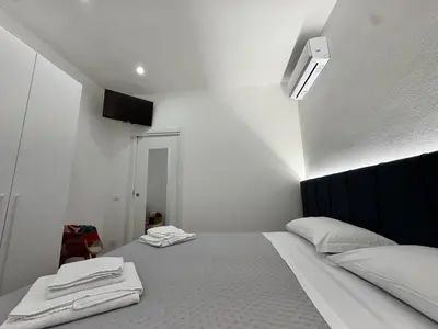 a bedroom with a bed with two towels on it at Al Grande Pino - Private pool, Jacuzzi and amazing Sunset in Campofelice di Roccella