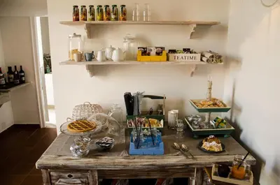 a table in a room with food on it at Guelio al Massimo Suites&Breakfast in Palermo