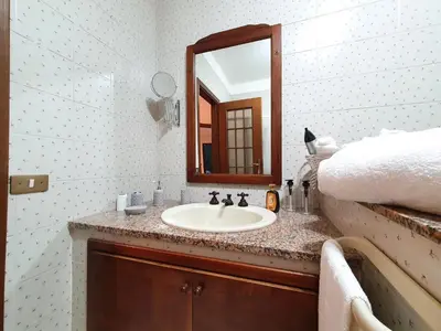 a bathroom with a sink and a mirror at Apartment Happy House by Interhome in Palermo