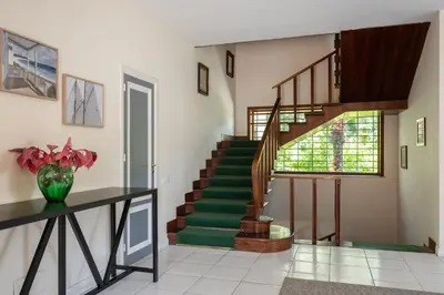 a staircase in a home with a vase of flowers at Villa Castelforte, con piscina a Mondello in Palermo