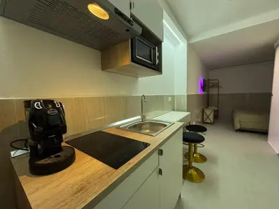 a kitchen with a sink and a mixer on a counter at Cappellieri centro apartament in Palermo