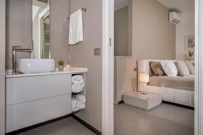 a bathroom with a sink and a bed at Villa Sikelia con fantastica piscina in Alcamo
