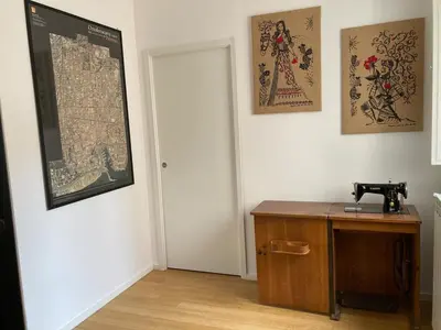 a room with a table and some pictures on the wall at Dai Pupi al 68 in Palermo