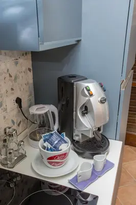 a coffee maker sitting on top of a counter at La Bucceria in Palermo