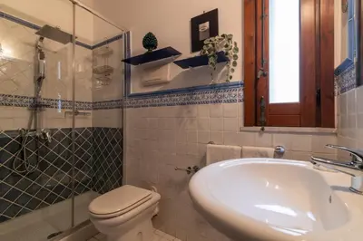 a bathroom with a sink and a toilet and a tub at GuestHost - Casa Giacomo in central Palermo in Palermo