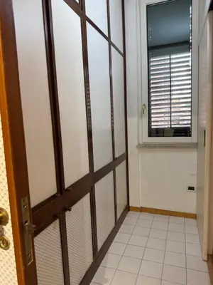 a room with a door and a window at La casa delle stelle in Palermo