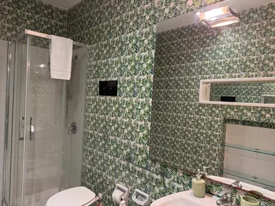 a bathroom with a shower and a toilet and a sink at La casa delle stelle in Palermo